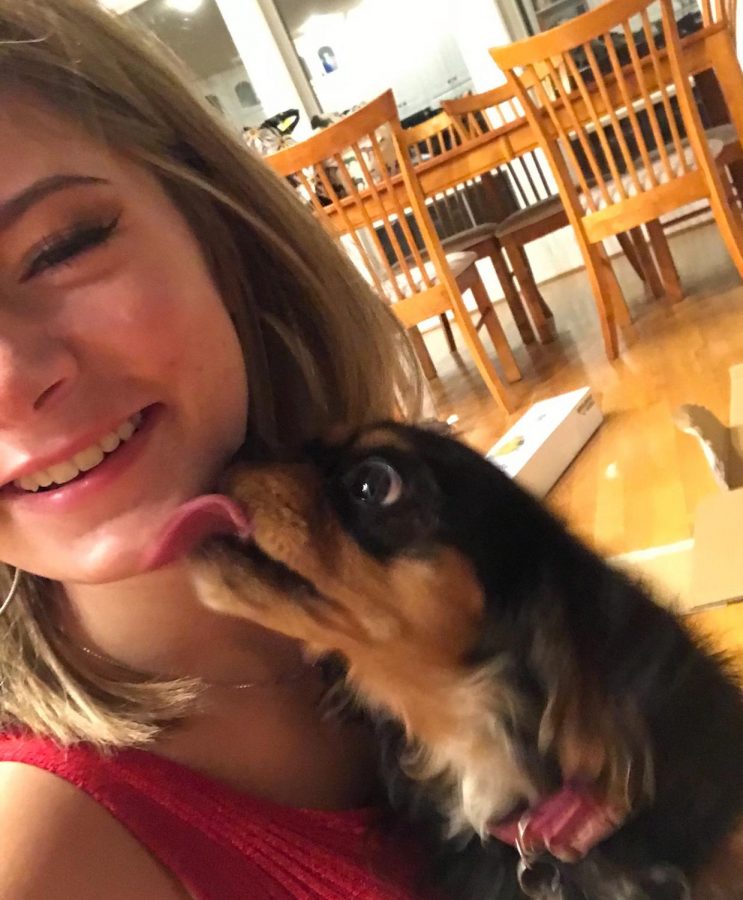 Me (Eva) saying goodbye to my dog on freshman move-in day. Sept. 2018. 