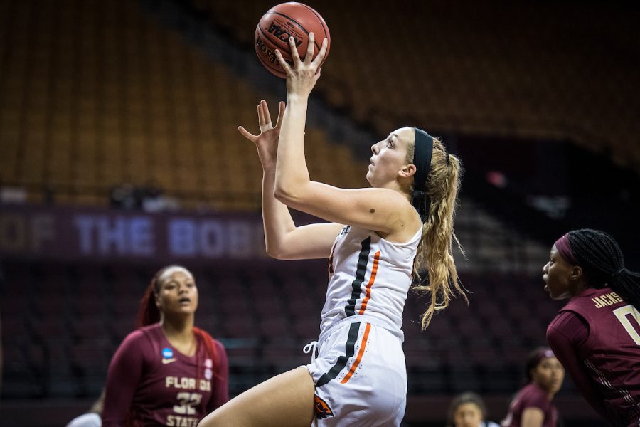 Pictured is forward Taylor Jones catching the ball and going to make the shot! They played against Florida State this year during the time of pandemic sports.