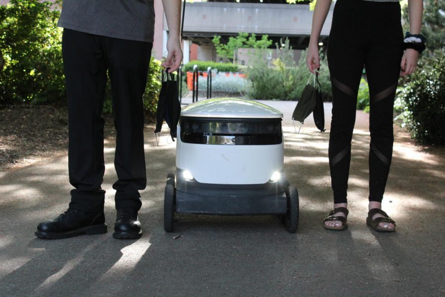 In these times, students find themselves thinking about what college would have been like if COVID was not around. Pictured is our reality, robots delivering your food, masks, and people standing six feet apart. 