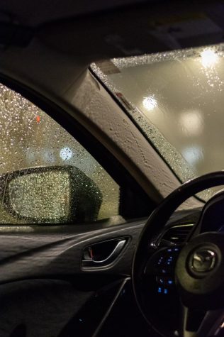 Photo of the inside of a vehicle with rain droplets on the windows on the night of Nov. 22, 2021.