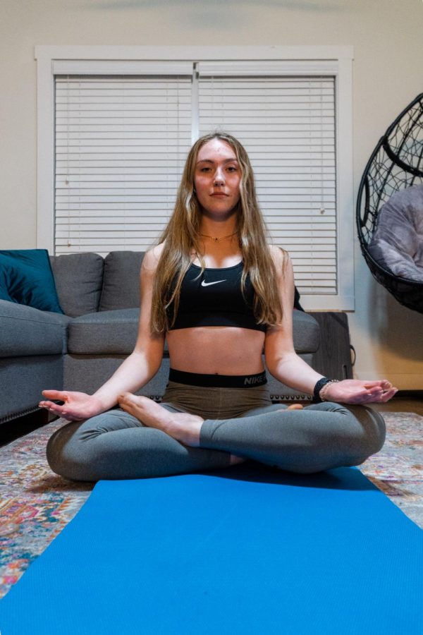 college student participating in yoga