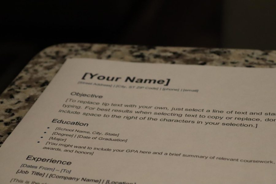 A photo of a basic resume outline sitting on a counter top.