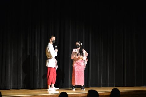 Eric Kong, left, and Karree Lee stand on stage together.