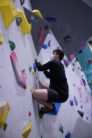 Oregon State University student Emerson Chase climbs for his first time since 2019 at The Valley Rock Gym.