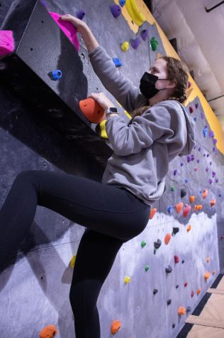 Oregon State University student Brooklynn Rawski climbs for her first time at The Valley Rock Gym