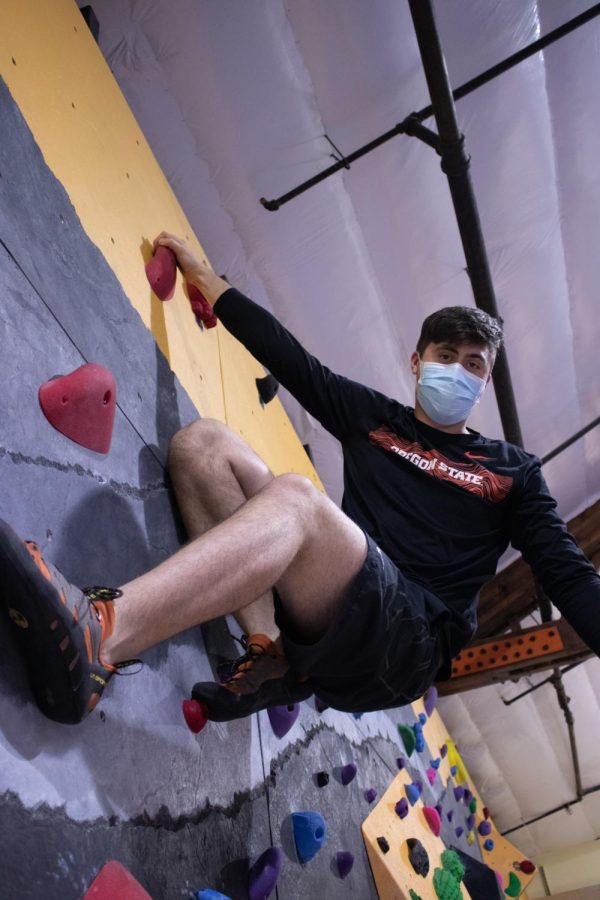 Oregon State University student Emerson Chase climbs for his first time since 2019 at The Valley Rock Gym.