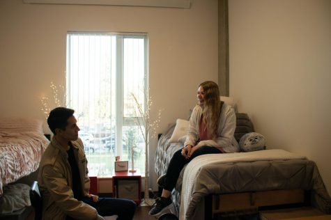 Freshman Kate Larson (right) chats with friend Connor Laureano