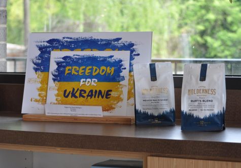 A sign that reads "Freedom for Ukraine" sits on a counter next to Coffee Culture's "Holderness Coffee."