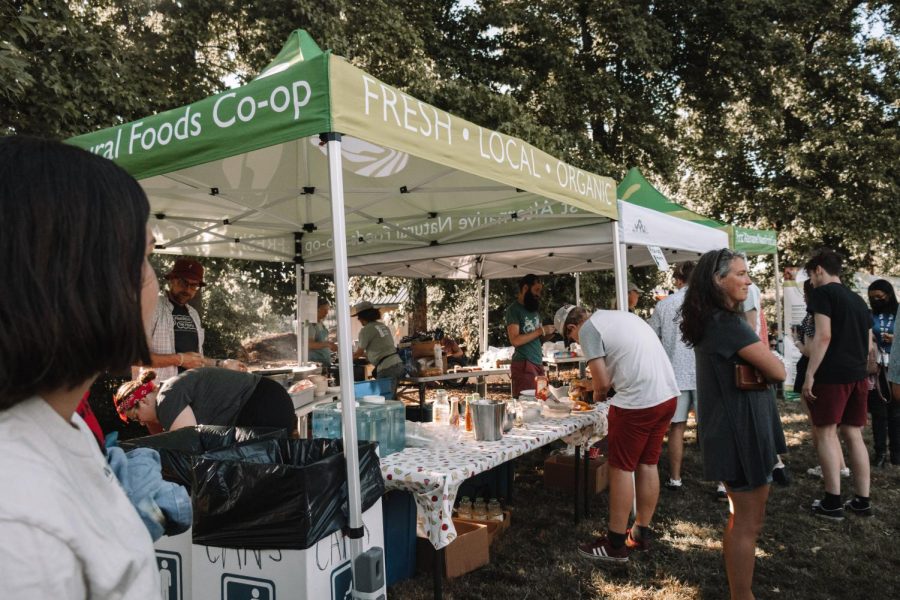 Corvallis residents gather near the First Alternative Co-ops tent at the 2022 SAGE concert series in Starker Arts Park. The series will continue through Aug. 18, hosted by the Corvallis Environmental Center.