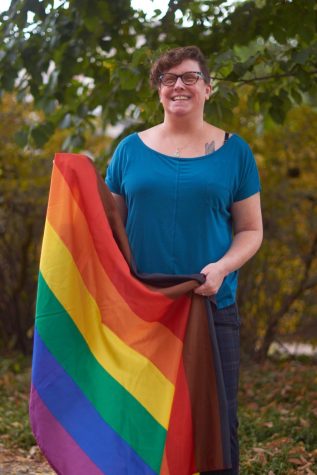 Pride Center Director Cindy Konrad posing with a Philadelphia pride flag on the OSU campus on Oct. 20, 2022. Konrad began working with Pride Centers at the University of Wisconsin- Whitewater before coming to OSU.