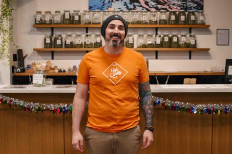 Brock Binder, owner of High Quality, poses inside the dispensary on December 5, 2022 in Corvallis.