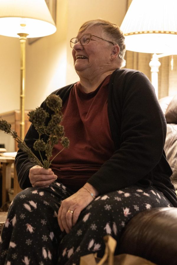 Annie (prefers to keep last name out; she/her) chuckles while discussing her experiences with smoking marijuana on Nov. 19 in her living room. Growing up, Annie stated how weed was frowned upon and viewed as a “hippie” activity.