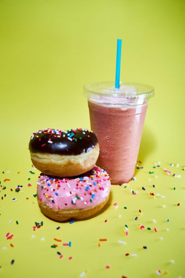 A strawberry banana smoothie, a chocolate sprinkle donut and a
strawberry sprinkle donut from Death by Donuts on January 23, 2023 in Corvallis,
Oregon. Death by Donuts offers hand filled, hand designed donuts, ready to eat!