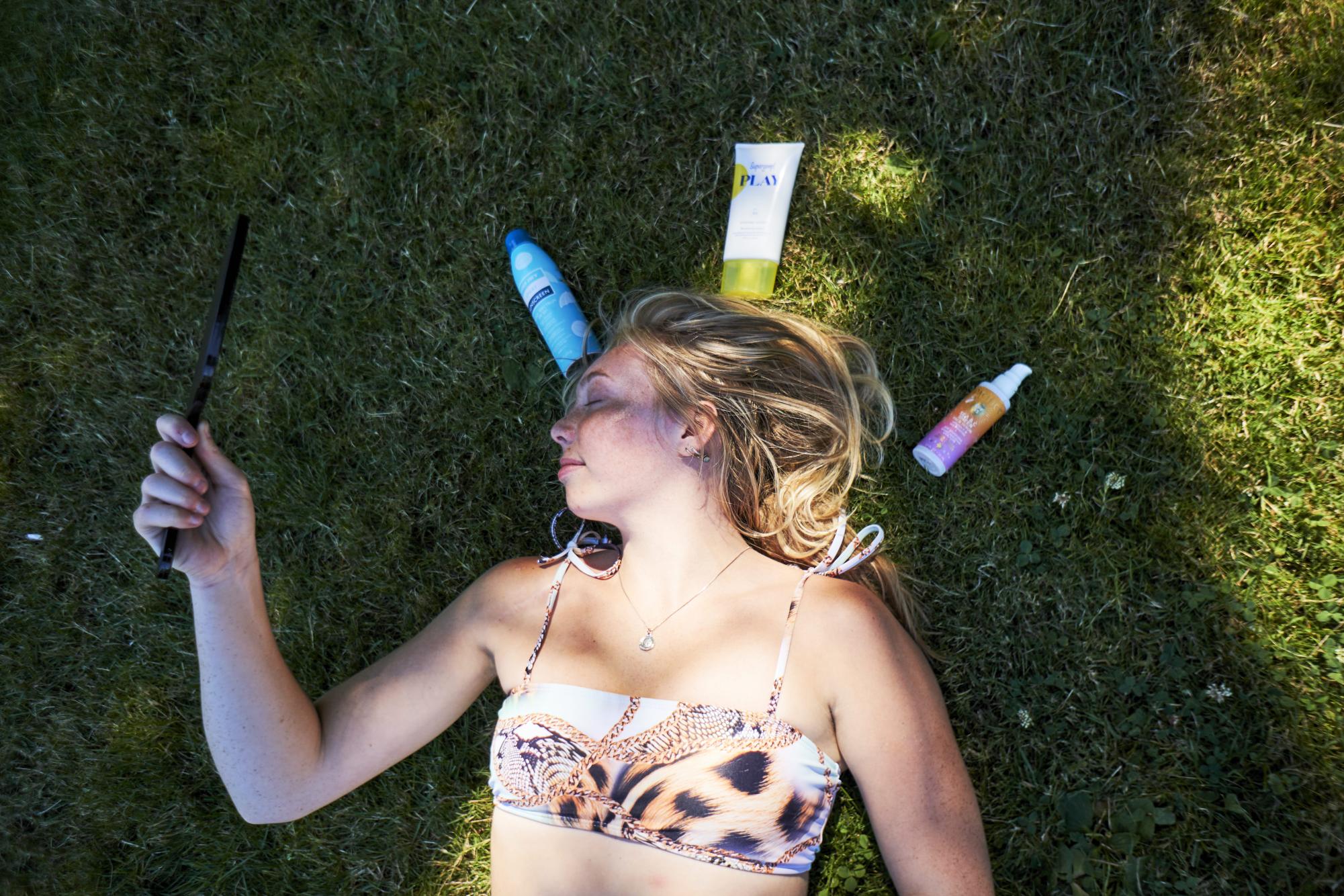Anna Yeates (she/her) after applying dewy facial sunscreen on July 22, in Corvallis. Reapplying sunscreen is extremely important to fully protect your skin and it is recommended to reapply every two hours.