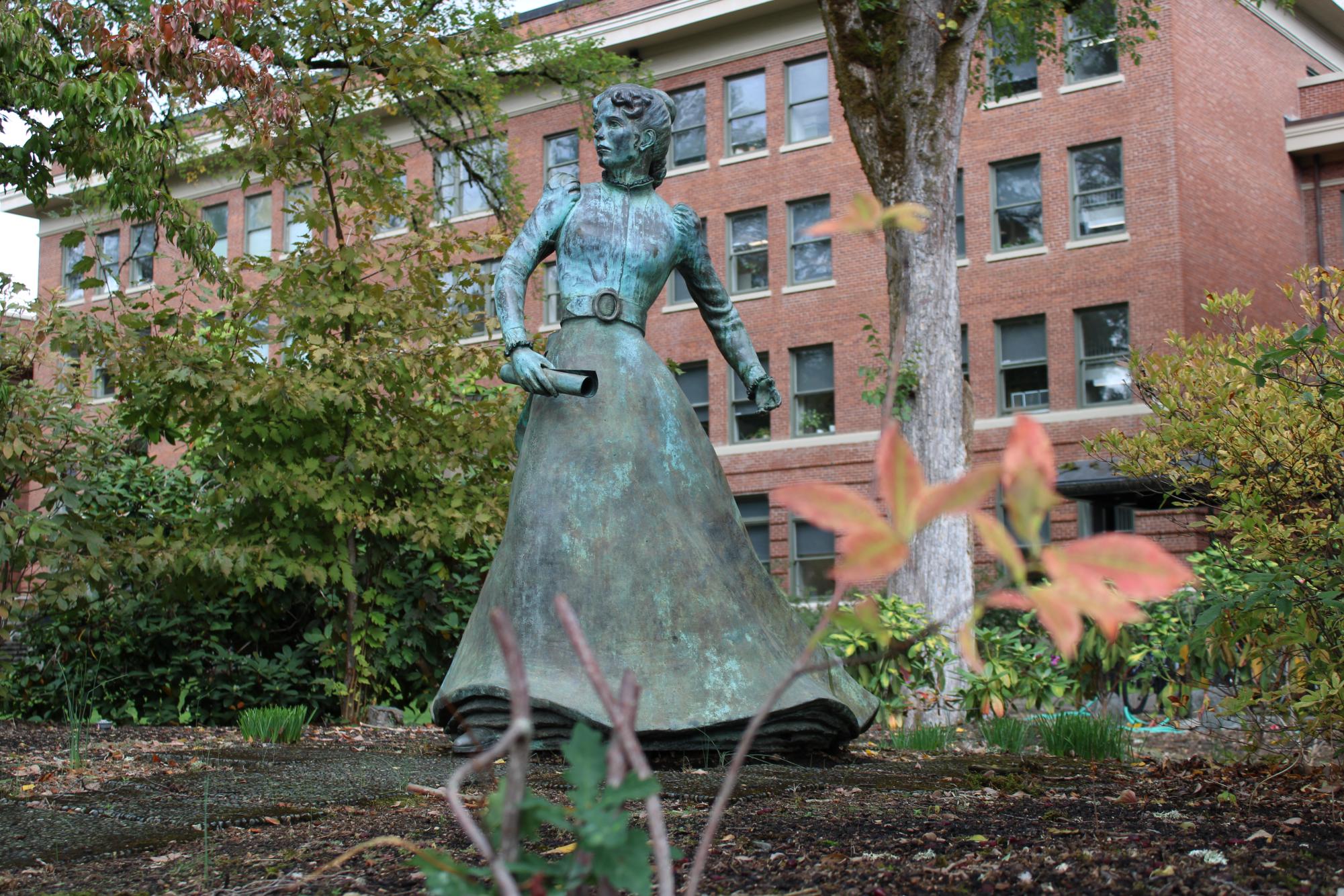 The bronze sculpture of Alice E. Biddle named ‘The Quest’ stands between Memorial Union and Strand Agriculture Hall at Oregon State on Sept. 29. The statue of Biddle holds a diploma, and was constructed in 1983.
