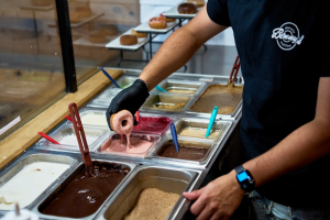 Benny’s Donut worker making a donut in Corvallis on Oct. 9. Benny’s Donuts was started in 2015 by an Oregon State men’s rower, who then accelerated the business through the Advantage Accelerator program within Oregon State business. 