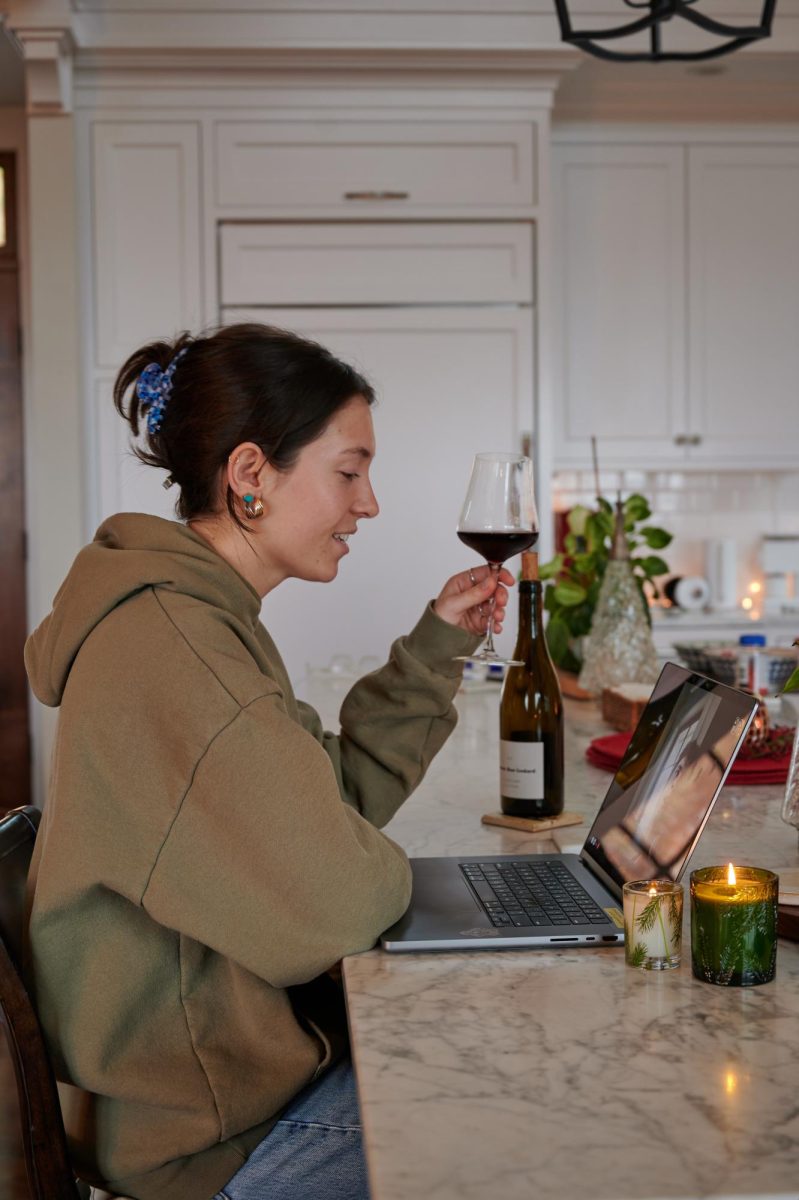 Evelyn Fox (pictured) and Chase Berryman drink wine and enjoy a Facetime date on Dec. 10. 