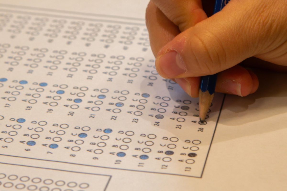 Student uses a SAT preparation sheet to study for the test.
