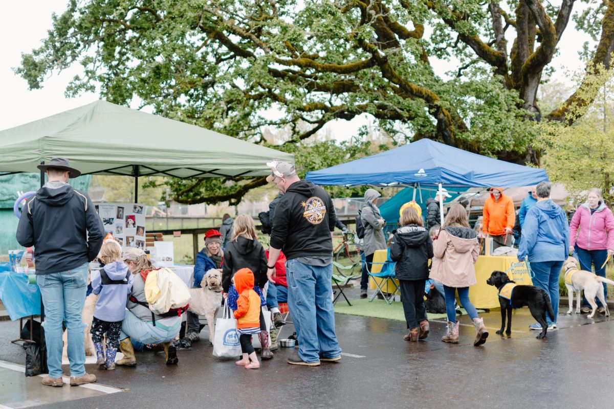 Members+of+the+Corvallis+community+gather+around+various+booths+at+Pet+Day+outside+of+Magruder+Hall.