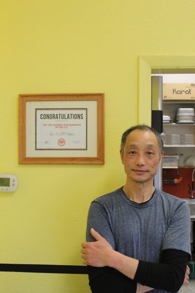 Yue Jay Chen stands next to a plaque he received for his restaurant, Tian Fu DIY Hotpot, being rated number nine on the list of country's top Chinese restaurants on Jan. 31. 