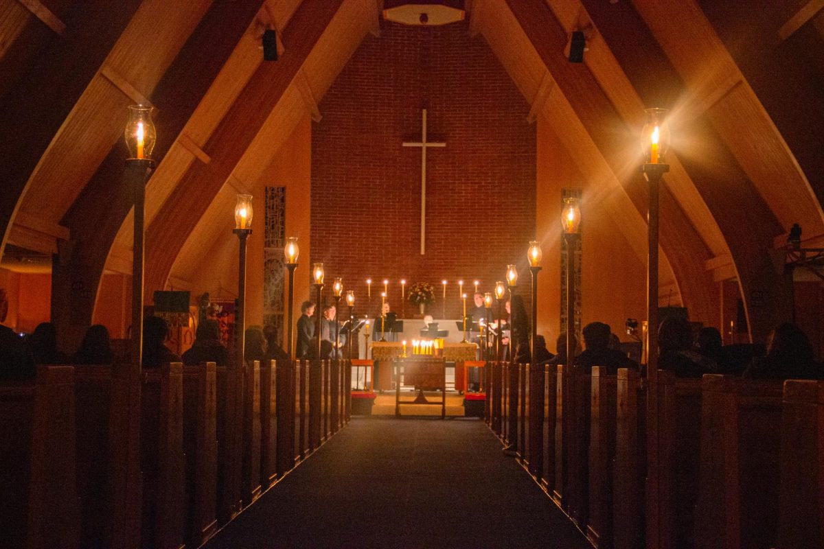 The Compline Choir of the Good Samaritan Episcopal Church chants in candlelight.