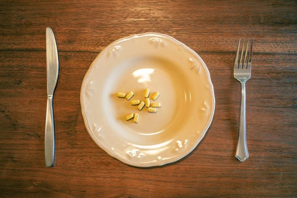 B vitamins sit patiently on a plate alongside dining utensils, ready to be consumed on April 29 2025. Before a night out, it is said that taking B12 vitamins may prove beneficial in order to steer clear of a hangover.