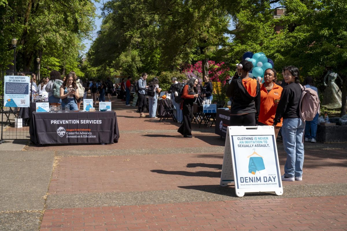 Students visit at the Memorial Union Brick Mall during the Denim Day Activity Fair on April 30. 

Hosted by Oregon State’s Center for Advocacy, Prevention and Education, the event aimed to raise awareness about sexual violence prevention and challenge harmful myths, including the notion that clothing invites assault.