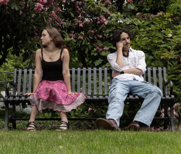 IThis photo illustration depicts Tuva Blom (left), a creative writing major, and Carter Pardu,e, a senior zoology major, as they sit in missed communication on Oregon State University campus in Corvallis, OR, on May 21, 2025.