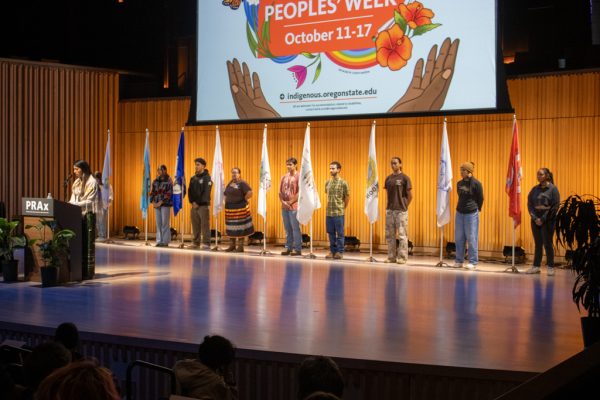 The flags of the nine tribes in oregon stand on the stage in Prax Oct. 13, 2025. A celebration event was held for Indigenous Peoples' Day.