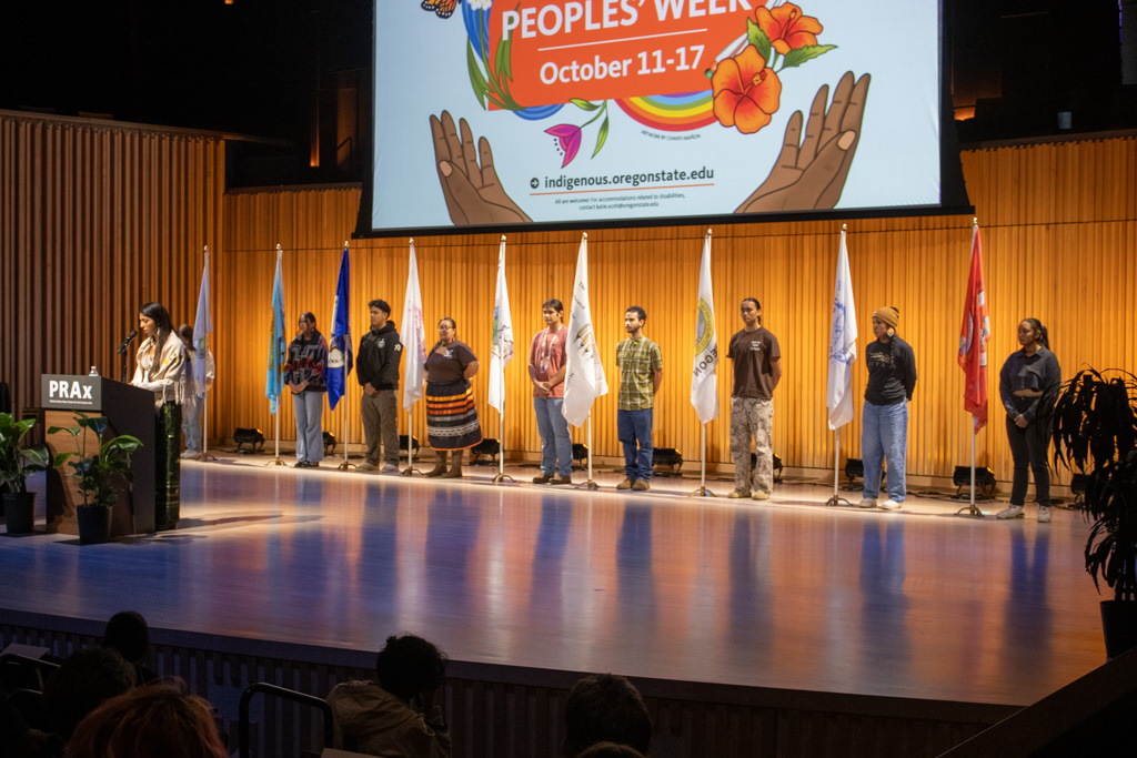 The flags of the nine tribes in oregon stand on the stage in Prax Oct. 13, 2025. A celebration event was held for Indigenous Peoples' Day.