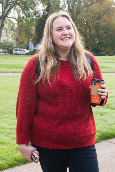 Brooke Musil, a member of the University Exploratory Studies Program, smiles while talking about her favorite festive meals on the Valley Library Quad on Oct. 16.