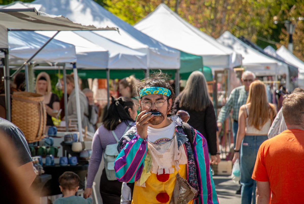 An attendee of the Corvallis Farmers’ Market walked down Northwest First Street while playing a harmonica in the early afternoon of April 25. The Corvallis Farmers’ Market takes place every Wednesday and Saturday from 9 a.m. to 1 p.m.